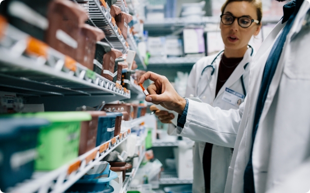 Pharmacy Tech Inspecting Drugs | Pharmaceutical Courier | American Courier Services